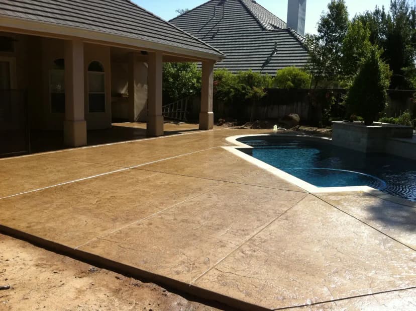 Stamped patio with pergola overhead